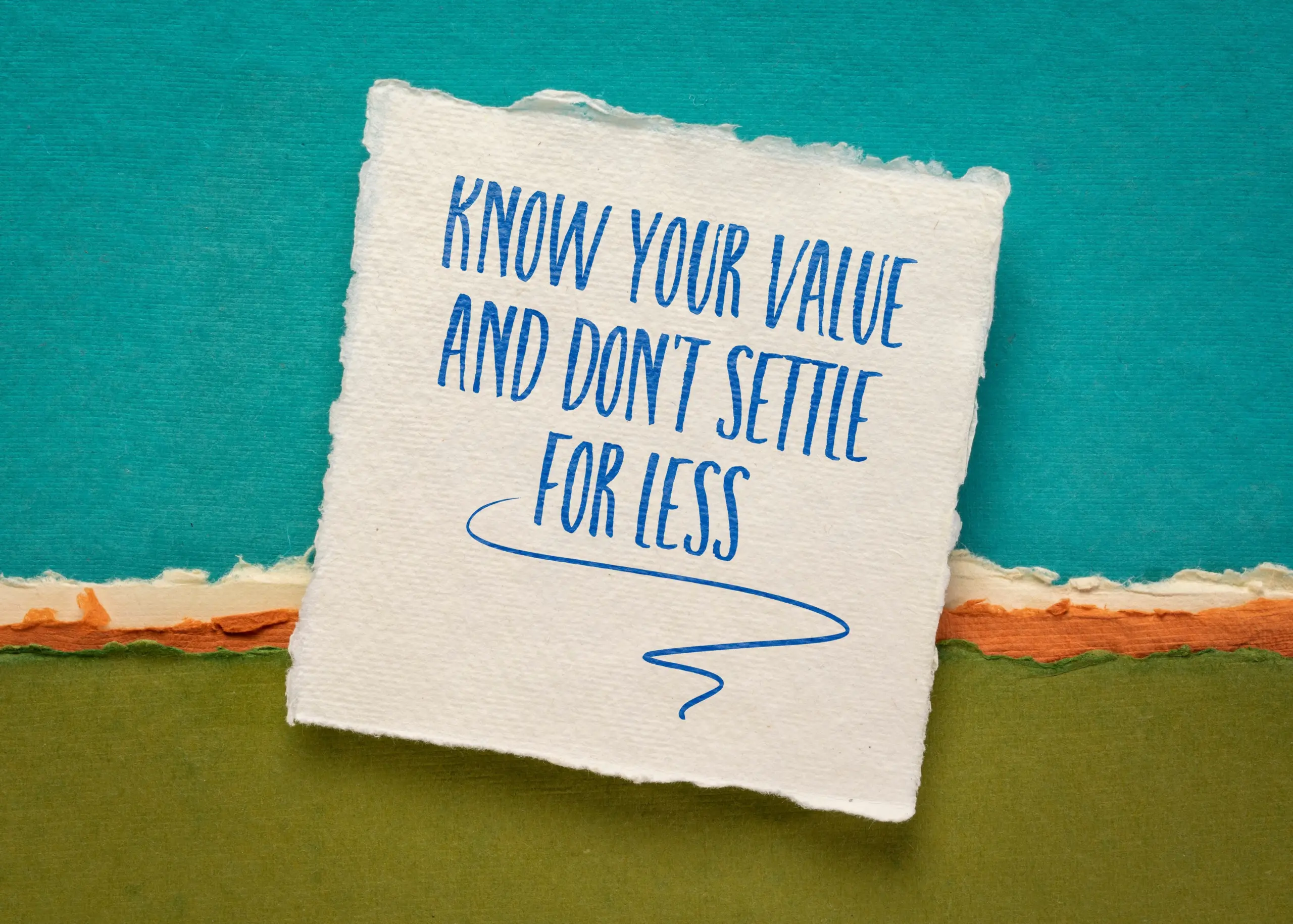 Know your value and do not settle for less inspirational handwriting on a white handmade paper against colorful abstract landscape, self confidence and personal development concept