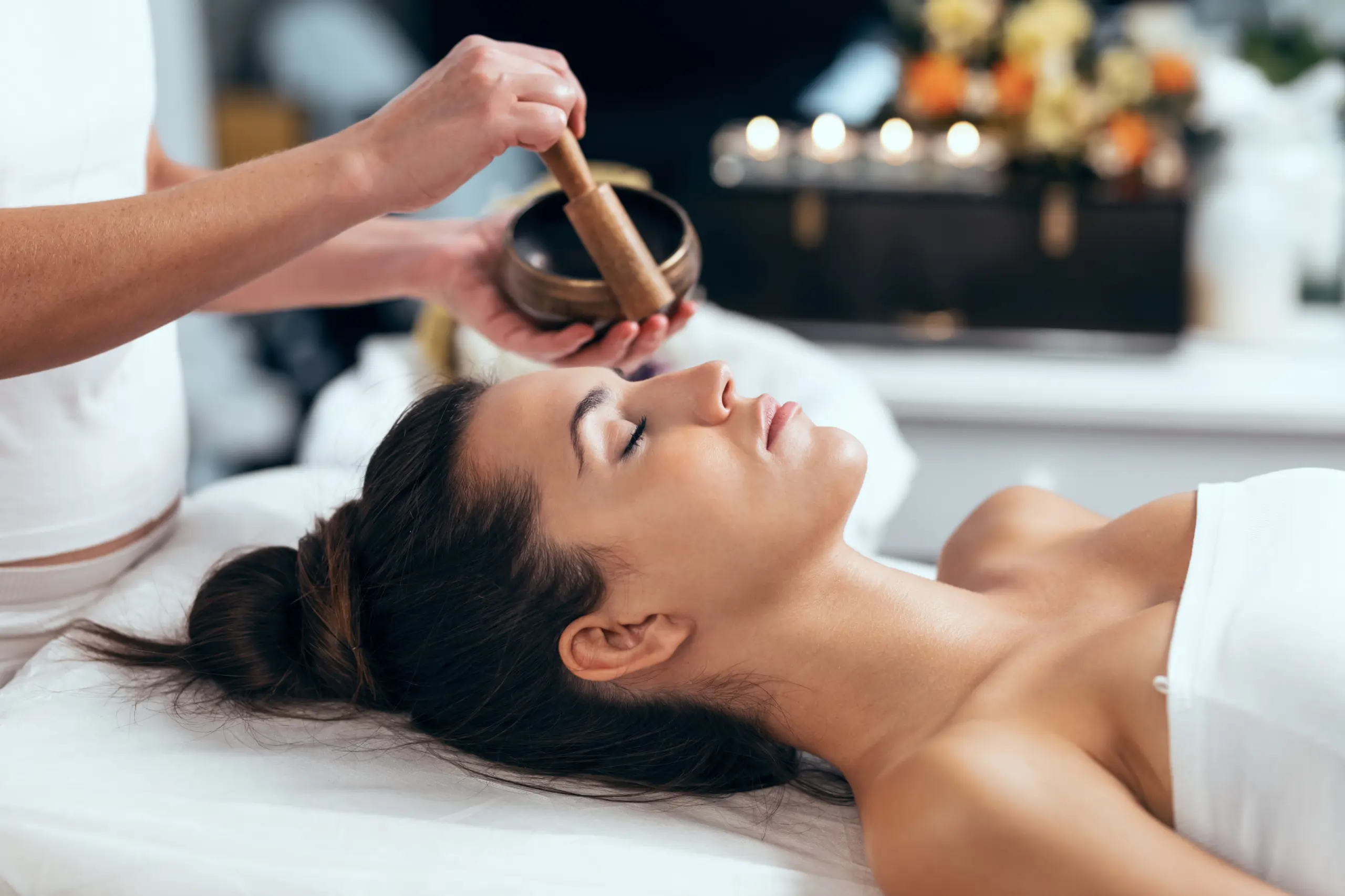 beautiful young woman having reiki healing treatment in Innervisions Recovery Center