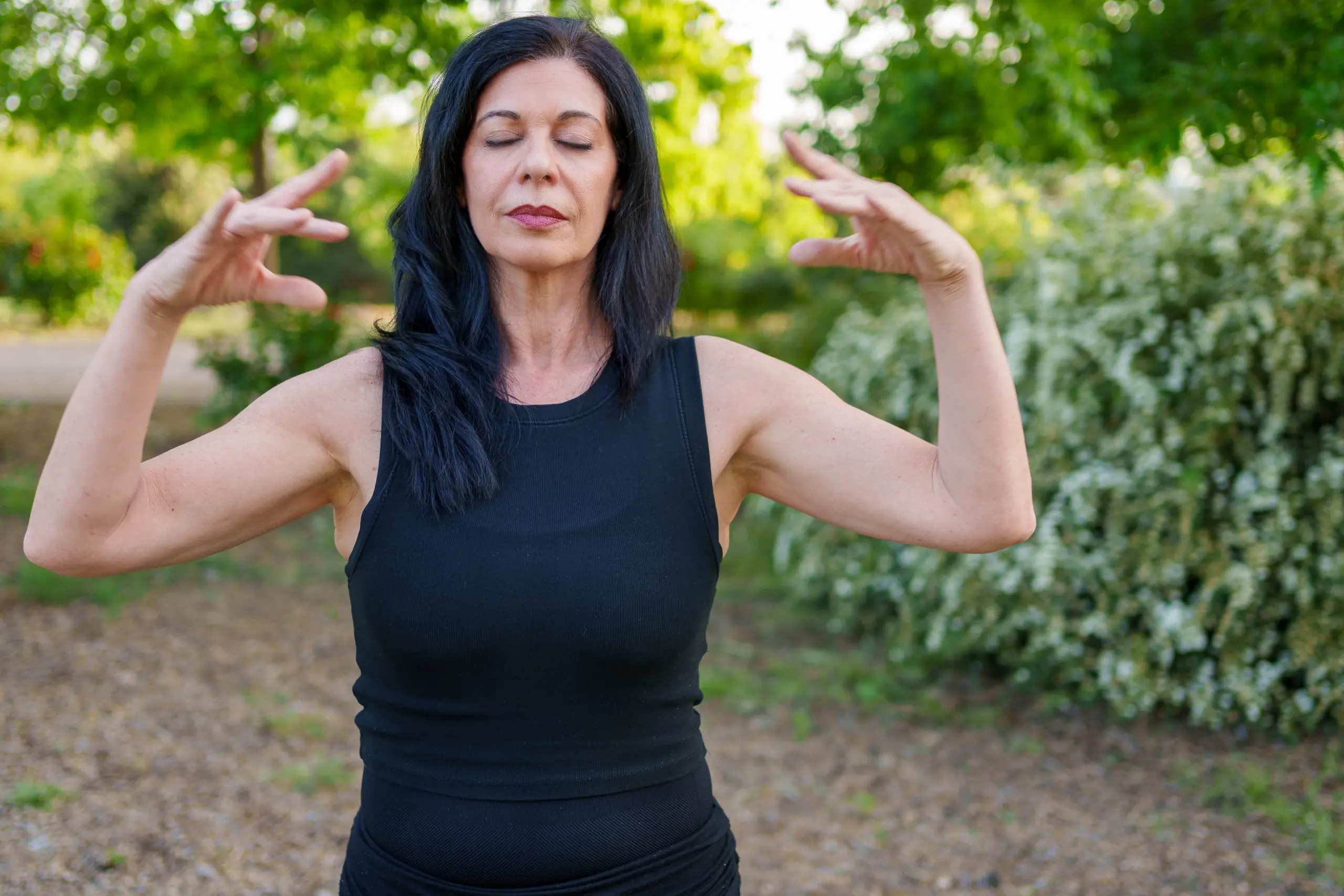 practicing tai chi chuan in a peaceful park setting